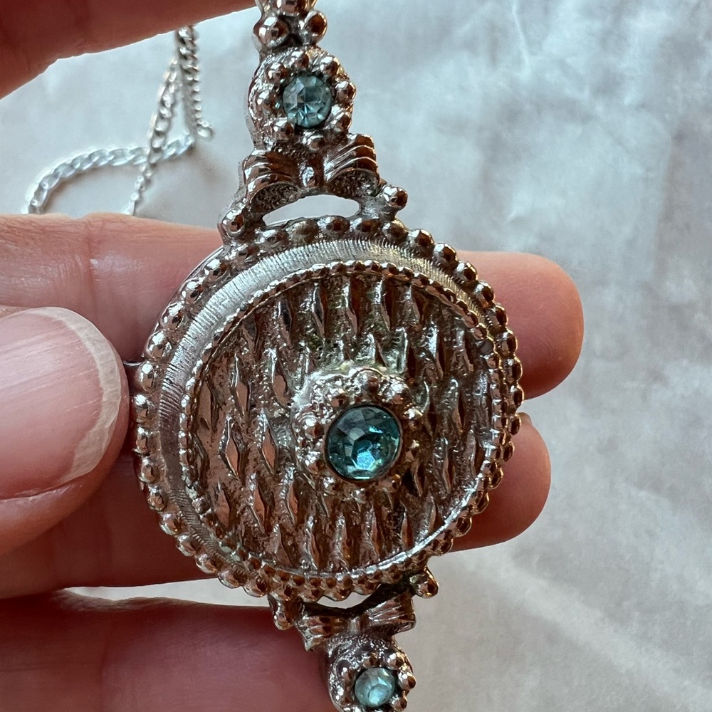Elegant Silver Tone Pendant with Aqua Blue stone Accents